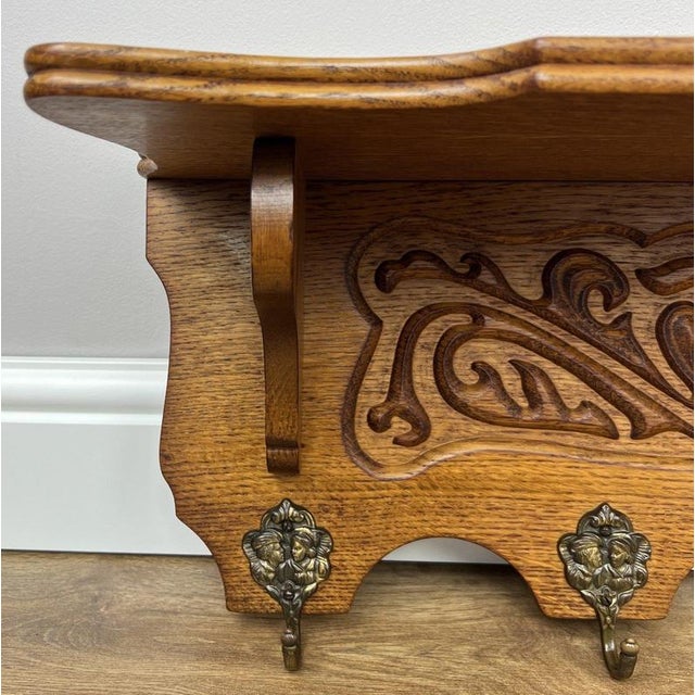 A beautifully crafted Vintage French coat hanger, featuring elegant carved detailing and a practical wall-mounted design....