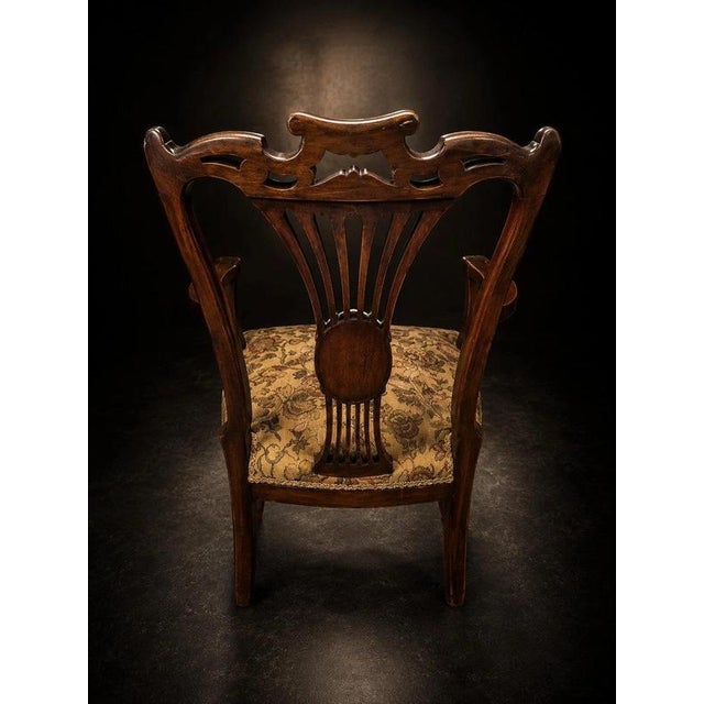 Victorian Carved Mahogany Armchair with Floral Upholstery and Brass Castors For Sale - Image 4 of 6