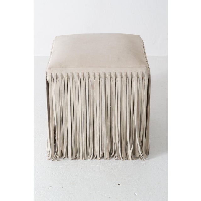 A fun Mod style square off-white suede ottoman with floor length suede fringe. It is 17.5" square and 19" high. It was...