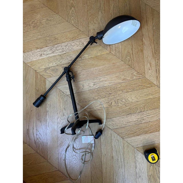 Restoration hardware (rh) black metal desk lamp with an industrial design inspired by vintage workshop lamps. features an...