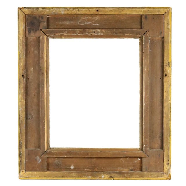 Rectangular frame in wood and gilt stucco, richly decorated with acanthus leaves and flowers on a sandy background. Louis...