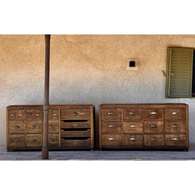 Pair of modernist oak counters with drawers on one side and decorated on the other sides, early 20th century. They have...