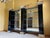 Beauty and design meet in this stunning art deco style wall display unit. Three black mirrored pillars with chrome molding...