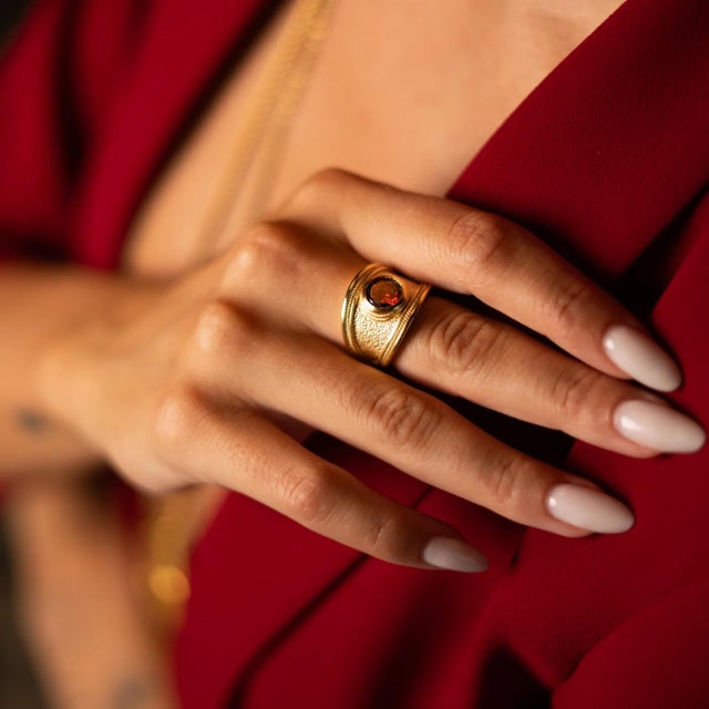 Elevate your style with the Majestic Ruby Gold Statement Ring, a bold and enchanting piece that blends timeless elegance...