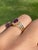 The Cardston: Ladies 14K Yellow Gold Ring set with Ruby and Diamond. The ring centers on a 0.75 carat oval ruby surrounded...