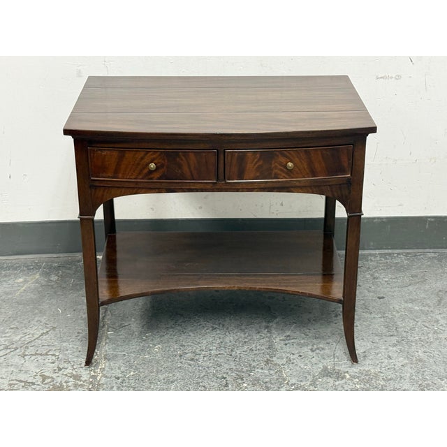 Design Plus Gallery presents the Waring Bow Front Side Table from Dessin Fournir. This mahogany table has a bow-front top,...