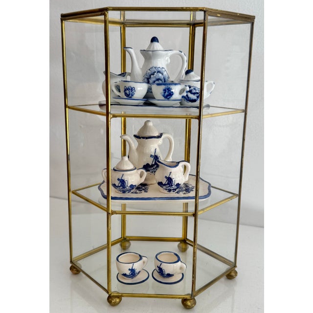 Late 20th century glass and brass three tier display case, perfect for your favorite miniatures. Please see condition...
