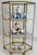 Late 20th century glass and brass three tier display case, perfect for your favorite miniatures. Please see condition...