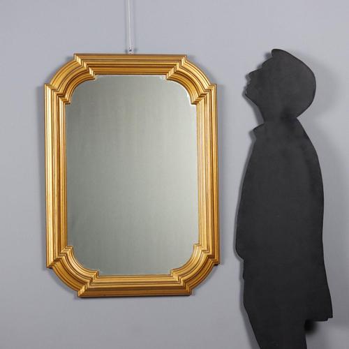 Wooden mirror with molded and gilded enamel frame. Italy, 20th century. This piece is attributed to the mentioned...