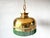 This vintage pendant lamp adds a touch of nostalgia to any room. with its gold metal finish and green fringes, it's a real...