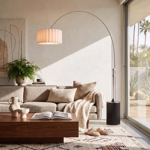 The Tambo Arc Lamp is a Mid-Century Modern lighting masterpiece designed by Peter Morelli in 1984. This elegant arc lamp...