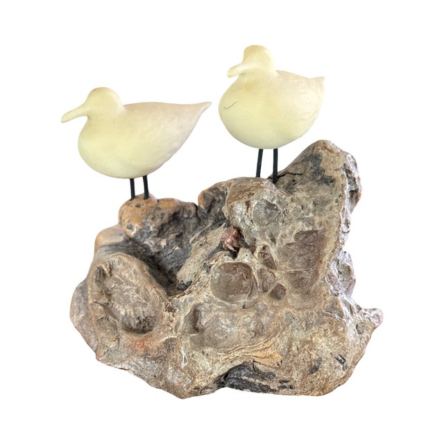 Description A sculptural 1970s decorative object featuring two stylized shorebirds mounted on a richly textured burl wood...