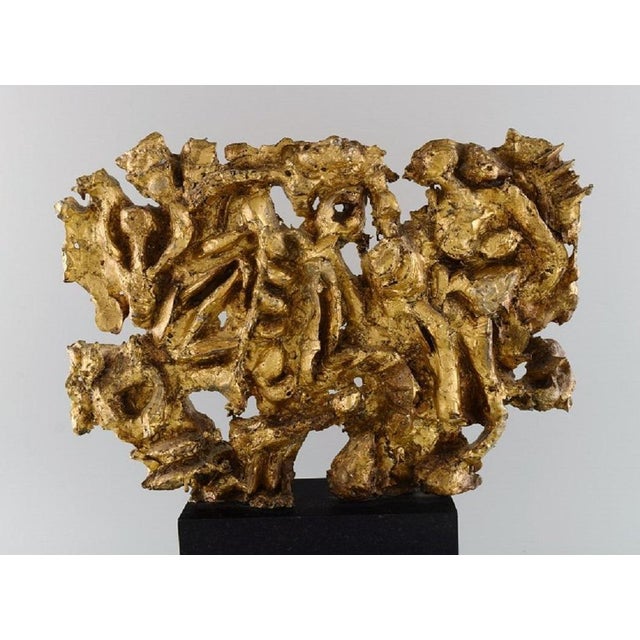 European sculptor. Large sculpture in gold decorated metal on a marble plinth. Late 20th century. Measures: 39 x 23 x 18...
