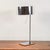 This modern table lamp is an excellent example of contemporary design, ideal for those seeking a minimalist and functional...