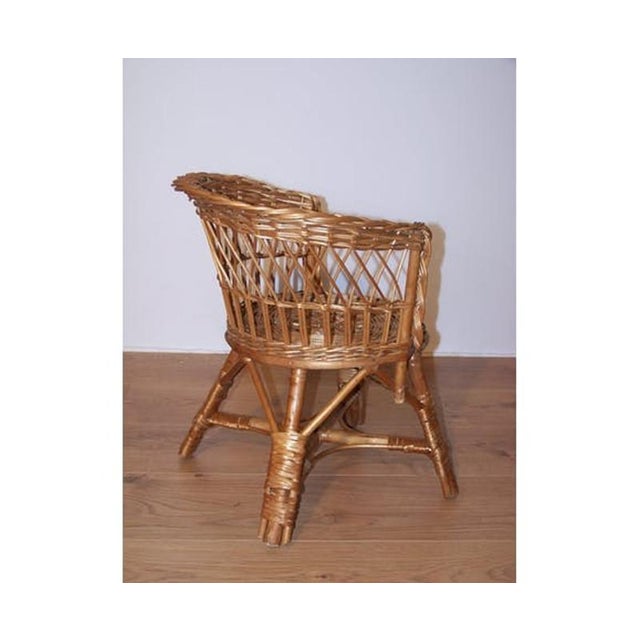 A beautifully crafted 1960s children's armchair made entirely of wicker, in very good condition considering its age. Seat...