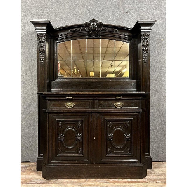 Exceptional and rare Napoleon III period sacristy buffet in ebonized wood, circa 1850 Front opening with two carved doors,...