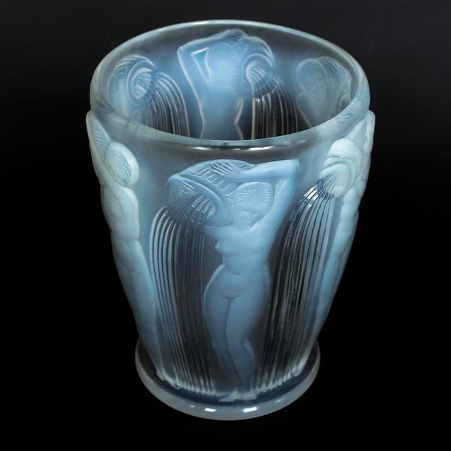 Danaides', an art deco frosted, opalescent glass vase by rené lalique (1860-1945). Decorated over with raised figures of...