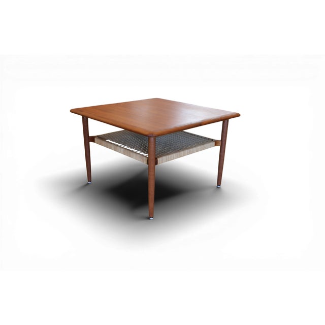 A magically beautiful Danish coffee table that really catches the eye with its elegant design and timeless style. A...