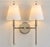 Notably polished and elegant take on the traditional candle sconce. Featuring two gracefully balanced arms, this double...