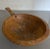Beautiful hand carved round wood bowl with handle. No makers mark. Would be a wonderful addition to a kitchen to...
