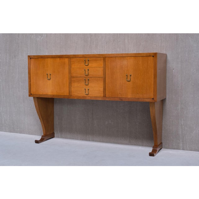 This elegant sideboard, crafted by a master cabinet maker in Italy during the late 1940s, was custom-designed for a...