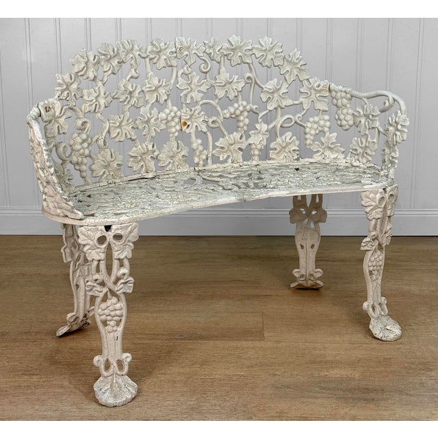 A 1970's Victorian Style Outdoor Garden Bench Wrought Iron with a Heavily Aged White Finish Chipping Shown Throughout -...