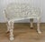A 1970's Victorian Style Outdoor Garden Bench Wrought Iron with a Heavily Aged White Finish Chipping Shown Throughout -...