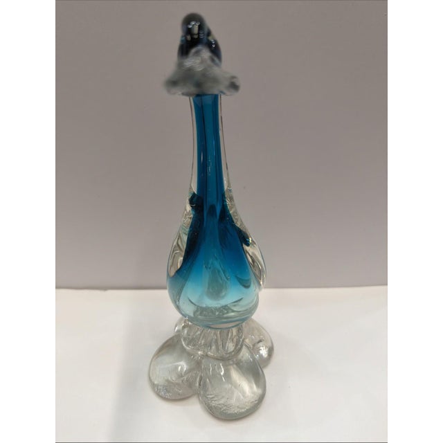 Vintage hand blown art glass bird in the Murano style. Features a graceful sculptural form with rich aqua blue cased glass...