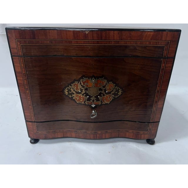 A very fine napoleon iii liquor cabinet. box veneered in thuya burl wood. Mahogany interior. two medallions in engraved...