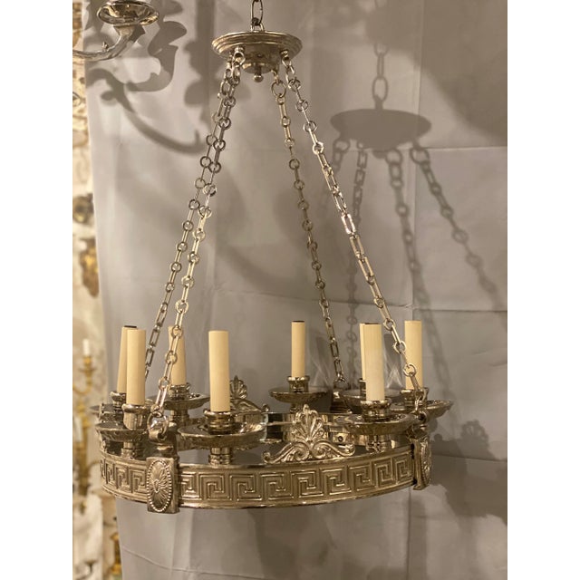 A circa 1900 silver plated Caldwell 8 lights chandelier with Greek key design (set available)