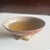Made using handcrafted ceramic techniques, the bowls feature a gradient glaze of pink and orange, with a petal-shaped base...