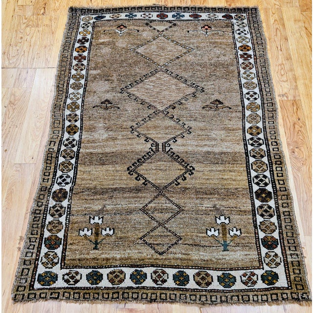 "The vintage Kurdish Bidjar area rug is a true gem of tribal weaving. This piece embodies the essence of ""beauty in...