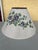 Beautiful large off white woven shade with purple flowers and bright green leaves. Measures 19” diameter and 10.5” tall