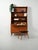 Swedish teak bookcase from the 1950s by Bodafors with a pull-out shelf, lower doors, two internal bentwood drawers, and a...