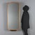 A 1960s Italian-made wall mirror featuring a finely crafted walnut frame. The elongated shape and beveled edges lend the...