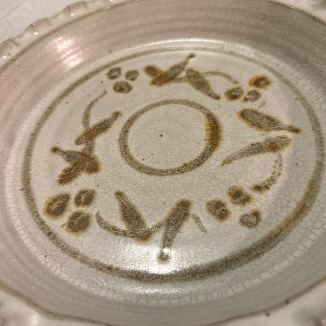 Add a touch of handcrafted charm to your home with this glazed pottery trinket dish. Perfect as a decorative pie plate,...