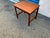 A finely crafted Scandinavian Modern occasional table or end table in highly figured warm toned teak. Finely honed curved...