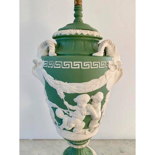 An elegant antique Wedgwood-style jasperware table lamp featuring the timeless neoclassical motifs that have made these...
