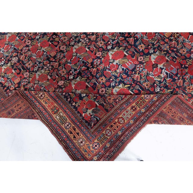An Early 20th Century Karabagh handmade rug features a fabulous allover design, consisting mainly of flowers, leaves and...