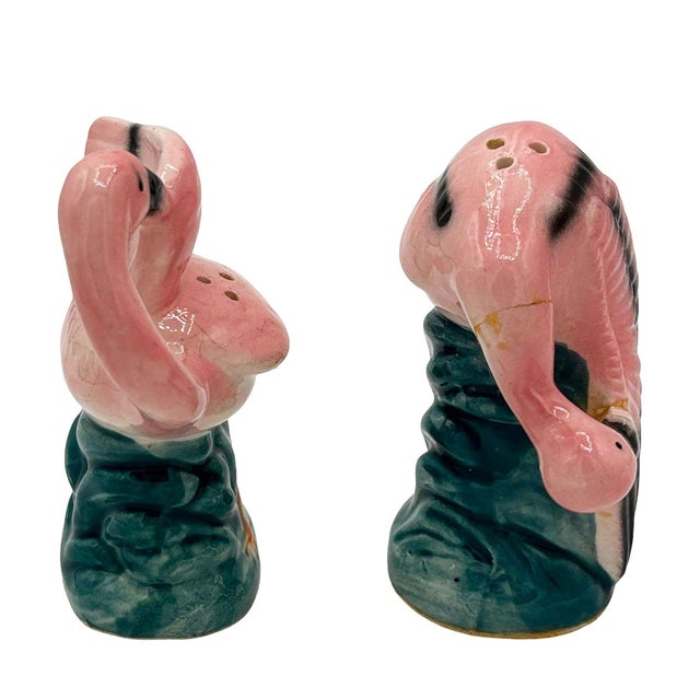 Mid-century pink and green ceramic flamingo tabletop salt & pepper shaker set. The set features two beautifully detailed...