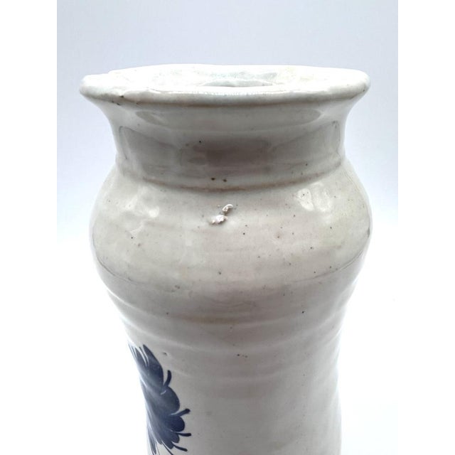 Hand-painted majolica (faience) apothecary jar with heraldic decoration. Origin & Mark: The jar originates from the...