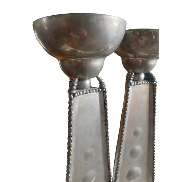 Pewter Mid-Century, Brutalist style pillar candlestick pair, signed and dated 1994. 15.5”h. With a repeated pattern of...