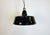 Industrial black enamel pendant lamp with white interior. Iron top. Manufactured during the 1950s. New porcelain socket...