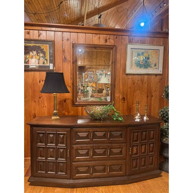 Beautiful MCM Walnut Spanish Style Credenza/Sideboard. Rich in color and tone. Pillow tufted design front. Brass hardware....