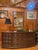 Beautiful MCM Walnut Spanish Style Credenza/Sideboard. Rich in color and tone. Pillow tufted design front. Brass hardware....