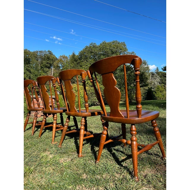 Set of six chairs, two with arms, 4 without. Splat back style backrest. Windsor colonial style chairs. Maple cinnamon...