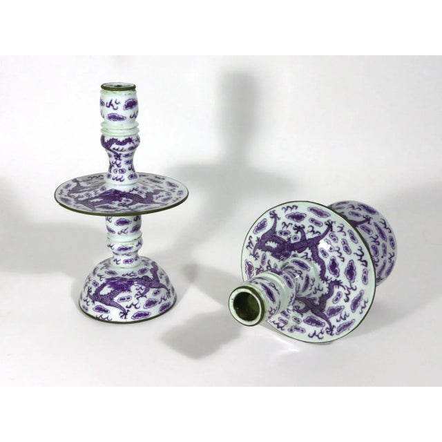 Chinese Export Porcelain Underglaze Blue Pair of Candlesticks, Circa 1850-80 The pair of Chinese Export underglaze blue...