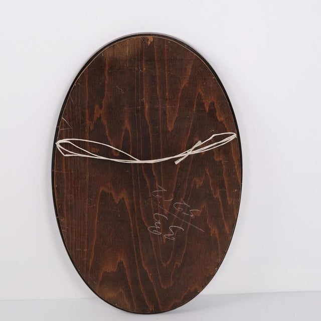 Oval mirror with a slim and elegant dark wood frame dating from the 20th century. Its simple design makes it suitable for...
