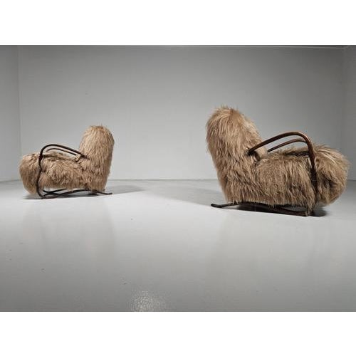 Jindrich Halabala, lounge chair, model ‘H269’, brown stained beech. Description : These beautiful chairs are reupholstered...