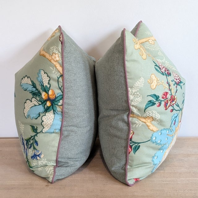 Brunschwig & Fils Fabriano pillows in Jade, with Samuel & Sons lavendar braided cord and green linen/wool blend backs....